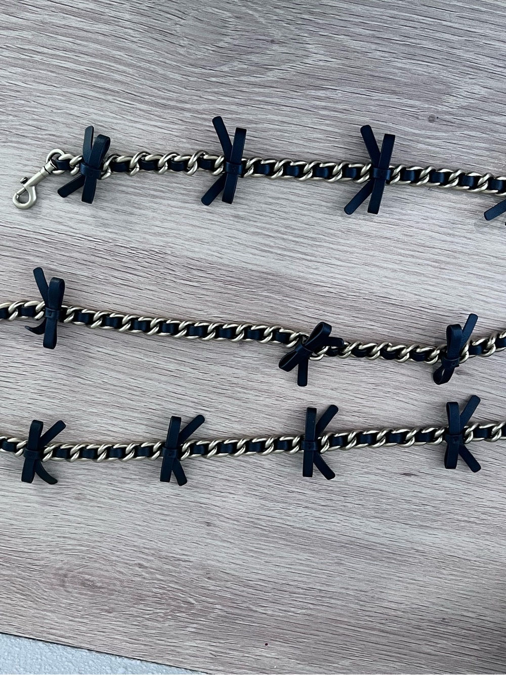 Coach Black and Gold leather bow strap